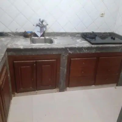a kitchen counter with a sink in a room at Captivating 4-Bed House in Tamaris in Tamaris