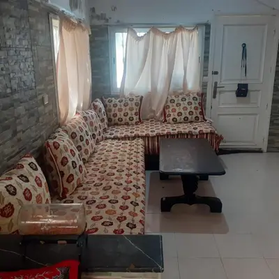 a living room with a couch and a table at Captivating 4-Bed House in Tamaris in Tamaris