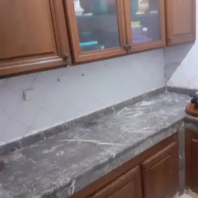 a counter top in a kitchen with wooden cabinets at Captivating 4-Bed House in Tamaris in Tamaris