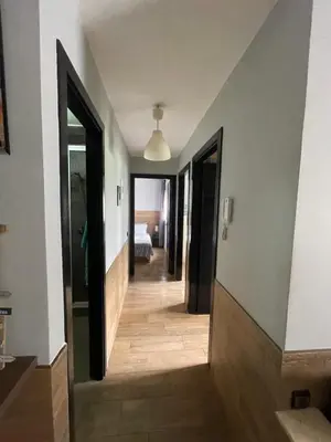 a hallway with a hallway leading to a bedroom at Cozy Apartment Dar Bouazza in Casablanca