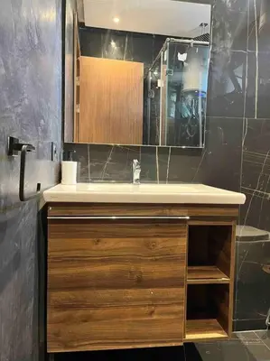 a bathroom with a sink and a mirror at Luxurious apartment in the heart of Maarif Casa in Casablanca