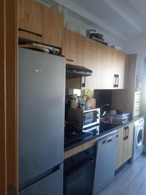 a kitchen with a refrigerator and a stove at Heaven Beach Front Apartment 2 Br in Sidi Rahal