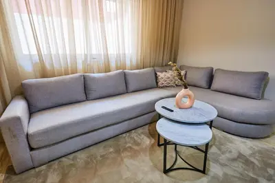 a living room with a couch and a table at City Escape Modern 1-Bed Near Casa Voyageurs in Casablanca