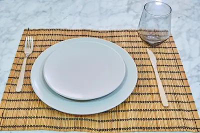 a plate and a fork and a glass on a table at City Escape Modern 1-Bed Near Casa Voyageurs in Casablanca