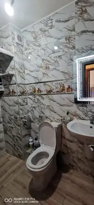 a bathroom with a toilet and a sink at Appartement Proche plage Bouznika Bouznika in Bouznika