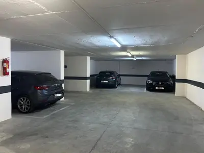 a garage with two cars parked in it at Modern City Centre Apartment in Casablanca