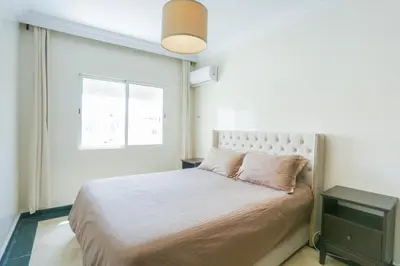 a bedroom with a large bed and a window at At Casablanca 's Home in Casablanca