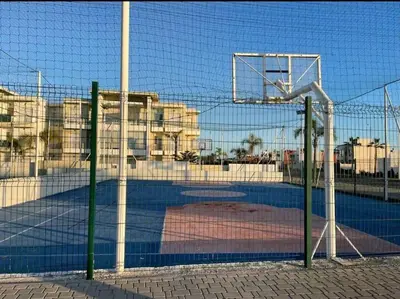 a net with a basketball hoop on a court at Beach condo at Casabay plage Sidi Rahal in Casablanca