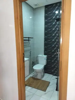 a bathroom with a toilet and a bath tub at Dahomey city in Bouznika