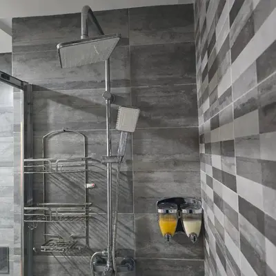 a shower stall in a bathroom with a shower at Appartement charmant au parc de Mohammedia, à seulement 2 pas de la plage in Mohammedia