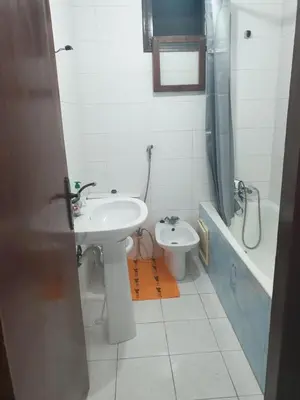 a bathroom with a sink and a toilet at إقامة الياسمين in Rabat
