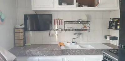 a kitchen with a sink and a counter top at إقامة الياسمين in Rabat
