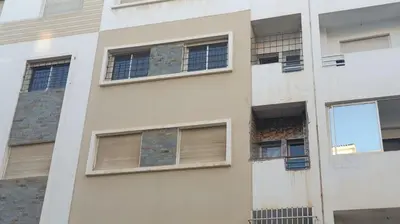 a facade of a building with windows at Zen and cosy Appart Rose Marie Kasbah in Skhirat