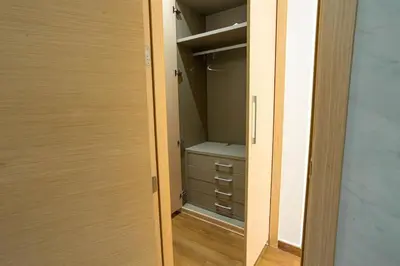 a walk in closet with a door open at Appartement avec piscine in Rabat