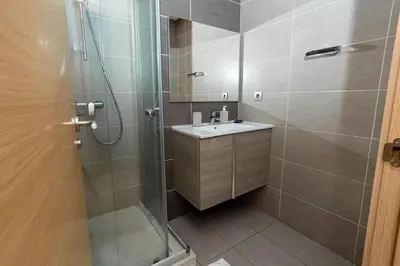 a bathroom with a shower and a sink at Appartement avec piscine in Rabat