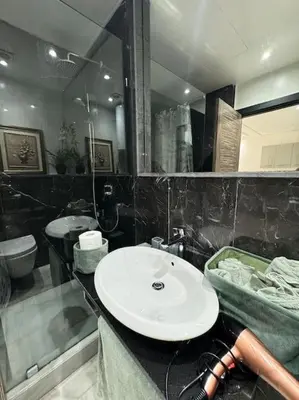 a bathroom with a sink and a toilet at Front of beach apartment marina yakht 2 in Casablanca