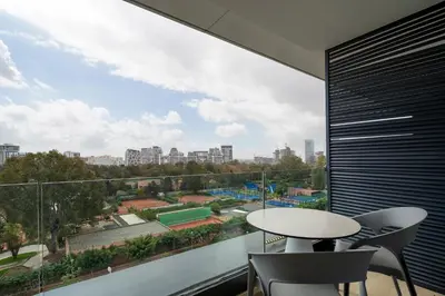 a room with a large window with a table and chairs at Eurostars Casa Anfa in Casablanca