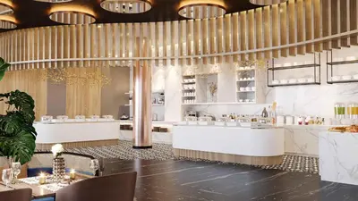 a restaurant with white counters and chandeliers at Eurostars Casa Anfa in Casablanca