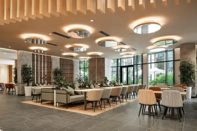 a restaurant with tables and chairs and windows at Eurostars Casa Anfa in Casablanca