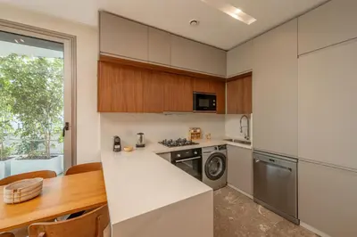 a kitchen with a stove top oven next to a table at Harmony Garden in Casablanca