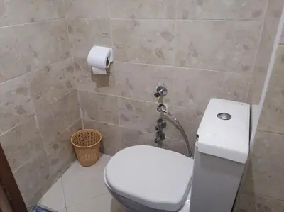 a bathroom with a toilet and a roll of toilet paper at Omarex in Casablanca
