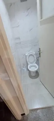 a bathroom with a white toilet in a stall at Appart RABAT AGDAL in Rabat