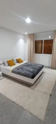 a bedroom with a large bed in a room at Appart RABAT AGDAL in Rabat
