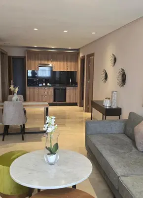 a living room with a couch and a table at AS Premium By Soho Hotels Maarif in Casablanca