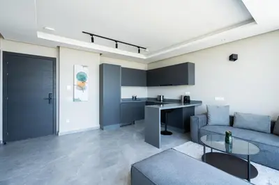 a living room with a couch and a table at Atlantic View Appart'Hotel in Casablanca