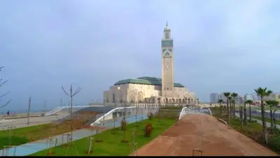 a large building with a clock tower in front of it at Boulevard Anfa in Casablanca