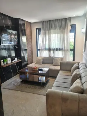 a living room with a couch and a coffee table at Anais house in Casablanca