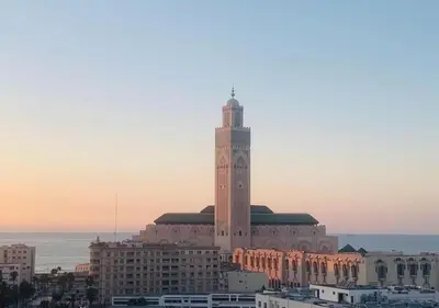 a building with a clock tower on top of it at Bel Appartement Cosy dans le centre de Casablanca in Casablanca