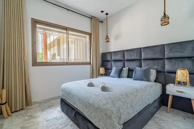 a bedroom with a large bed and a window at AeroStudio in Nouaceur