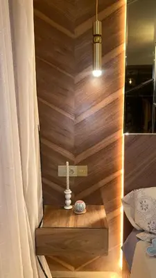 a corner of a room with a wooden wall at Bleu Beach Résidence, Sidi Rahal in Sidi Rahal