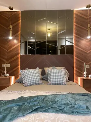 a bedroom with a large bed with a large mirror at Bleu Beach Résidence, Sidi Rahal in Sidi Rahal