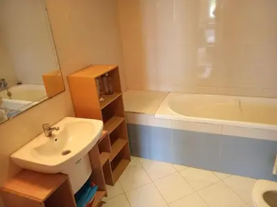a bathroom with a sink and a bath tub at Sun Palace Palage des Sablettes D5 in Mohammedia