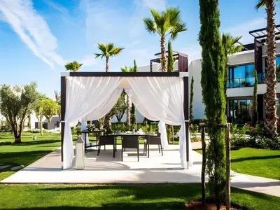 an outdoor wedding gazebo with a table and chairs at STORY Rabat in Rabat
