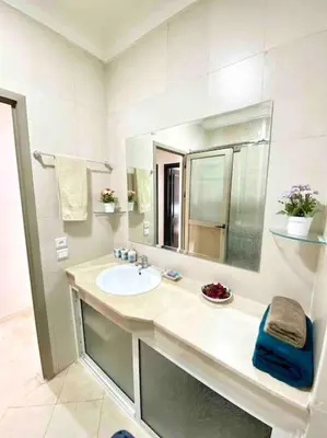 a bathroom with a sink and a mirror at Sweet Home in Casablanca