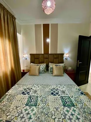 a bedroom with a large bed in a room at Sweet Home in Casablanca