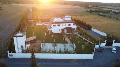 an aerial view of a house with a basketball court at Bens White House in AÃ¯n el Ksob