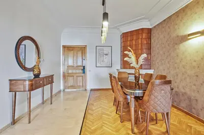 a dining room with a table and a mirror at Spacious 2 Bed Flat with City Views and Free Parking in Casablanca