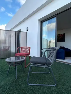 two chairs and a table on a balcony at Executive Boutique Hotel Rabat in Rabat