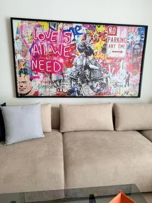 a couch in a room with a painting on the wall at APPARTEMENT LUXUEUX 29 neuf avec terrasse in Casablanca