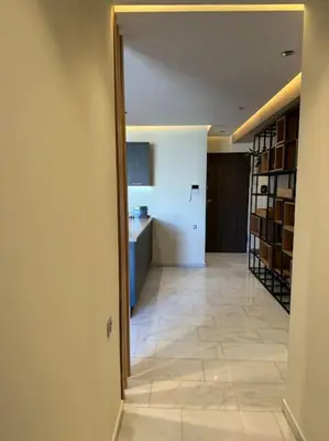 a room with a hallway with a kitchen and a kitchenasteryasteryasteryasteryastery at Classy presidential apartment in Casablanca