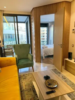 a living room with a couch and a table at Presidential living princess in Casablanca