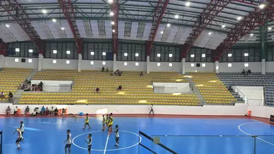 a volleyball game in a gym with a court at Grenn appt in Rabat