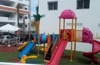 a playground with a slide and a slideintend at La siesta beach resort two bedroom appartement in Mohammedia