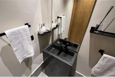 a bathroom with a sink and white towels at Le studio in Casablanca