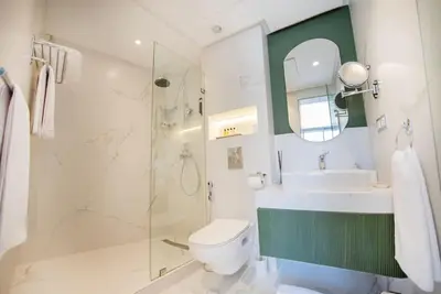a bathroom with a shower and a toilet and a sink at Magnifique Studio neuf in Casablanca