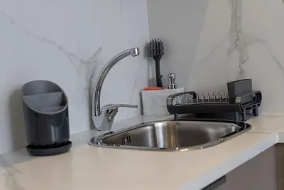 a kitchen counter with a stainless steel sink at Magnifique Studio neuf in Casablanca